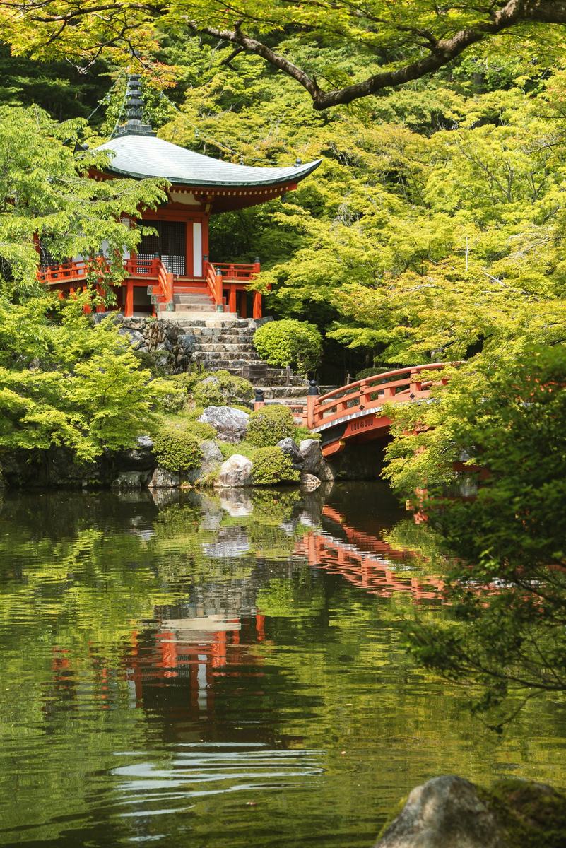 Daigo-ji temple and its red bridge reflected in a pond, Kyoto